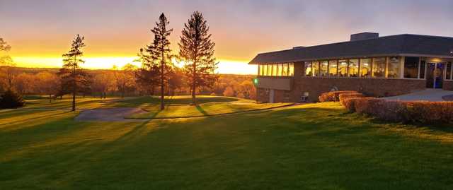 A sunset view of the clubhouse at Bristol Oaks Golf Club and Banquet Center.