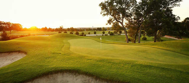 A sunny day view of a hole at Coyote Ridge Golf Club.