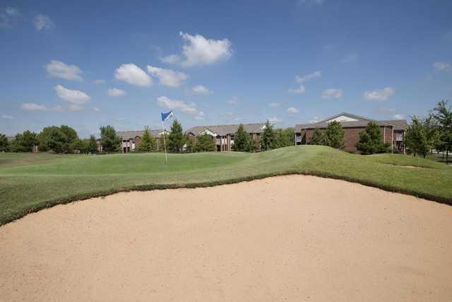 A sunny day view of a hole at Longhills Golf Course.