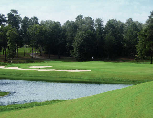 A view of a green with water and bunkers coming into play at Southern Hills Golf Club.