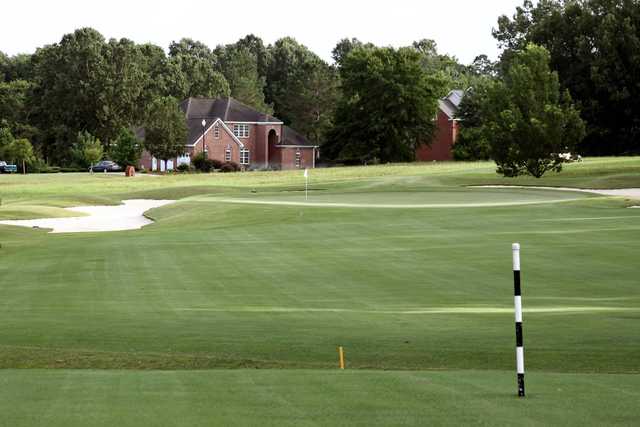 A view of a green flanked by bunkers at Southern Hills Golf Club.