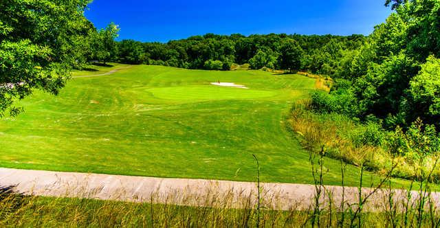 A sunny day view of a green at Salem Glen Country Club.