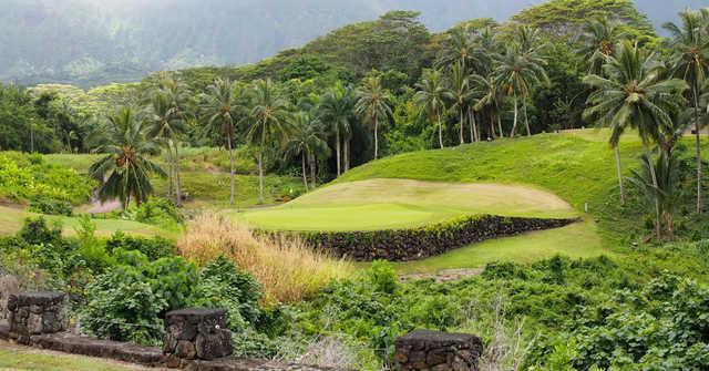 A sunny day view of a green at Royal Hawaiian Golf Club.