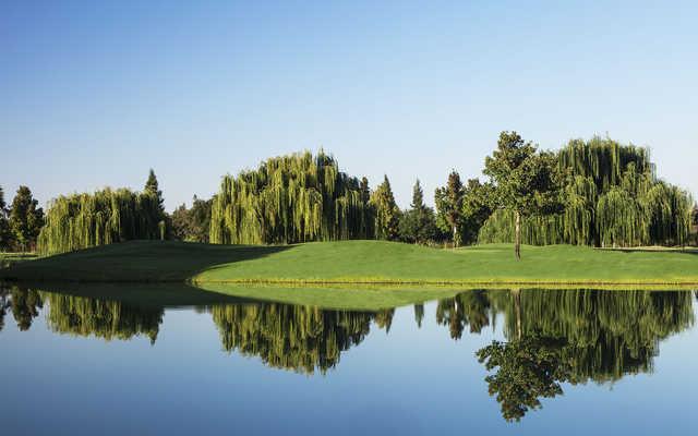 A view over the water of hole #17 at Creekside Golf Course.