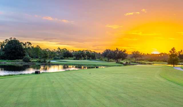 A sunset view of a well protected hole at River Hall Country Club.