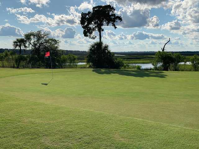 A sunny day view of a green at Laurel Island Links.