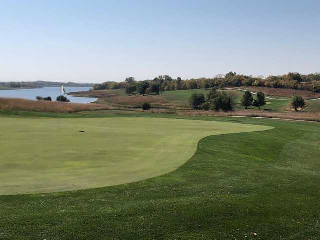 A fall day view of a green at Mozingo Lake Recreation Park Golf Course.