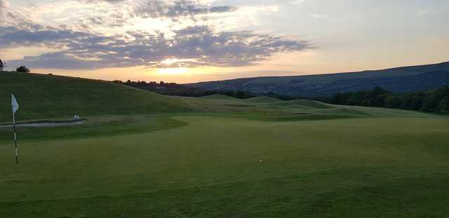 A sunset view of a hole at Garnant Park Golf Club.