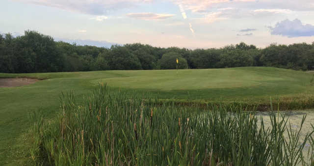 A view of a green with water coming into play at Garnant Park Golf Club.