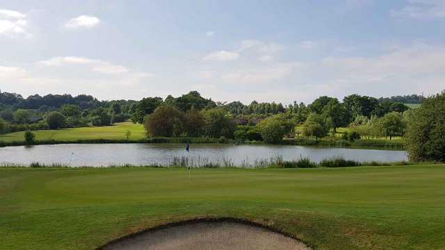 A view of a hole with water coming into play at Reigate Hill Golf Club.