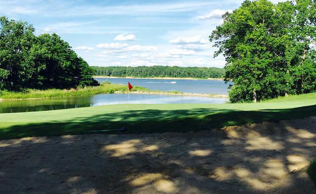 A sunny day view of a hole at Eagle Creek Golf Course.