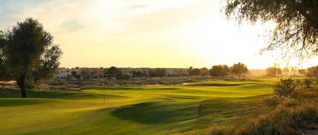 A sunny day view of a hole at Arabian Ranches Golf Club.