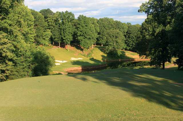 A sunny day view of the 6th green at Jackson Course from Rock Barn Golf and Spa.