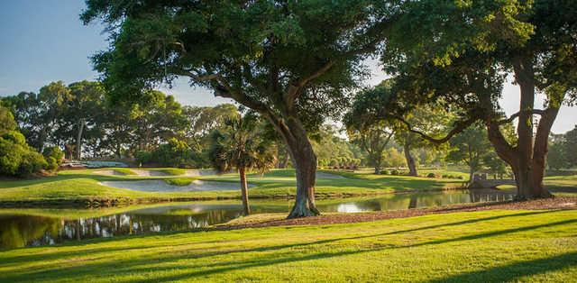 A view over the water of a green at The Dunes Golf & Beach Club.