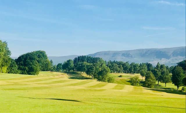 A sunny day view of a fairway at Kirkintilloch Golf Club.