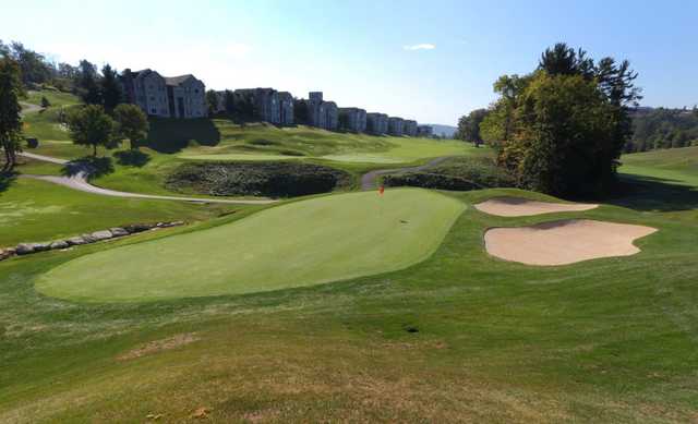 A view of a green protected by two bunkers at The Lakes Golf Club.