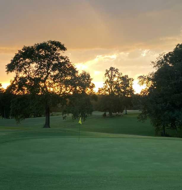 Sunset view of the 18th green at Yadkin Country Club.