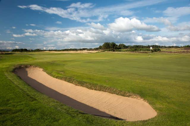A sunny day view of a hole at Glasgow Gailes Golf Club.