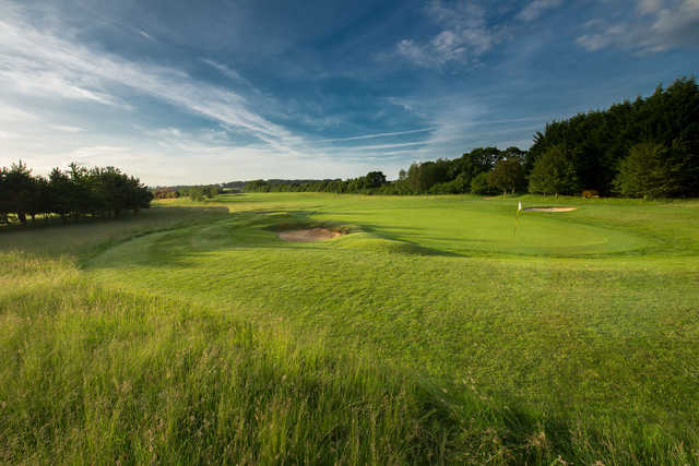 A sunny day view of a hole at Test Valley Golf Club.