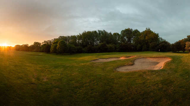 A sunset view of a hole at Brampton Park Golf Course.