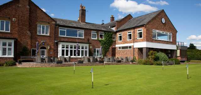 A view of the clubhouse and the putting green at Wilmslow Golf Club.