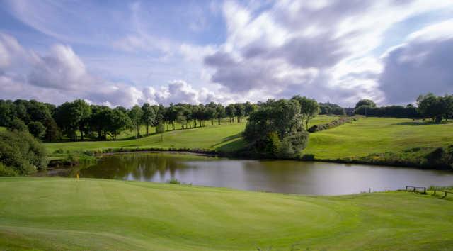 A view of a green with water coming into play at Trethorne Golf Club & Hotel.