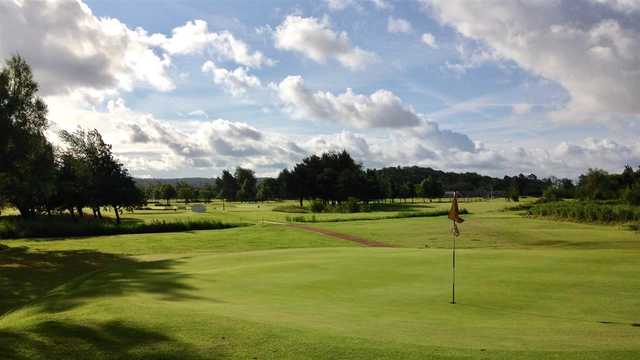 A sunny day view of a hole at Grange-over-Sands Golf Club.