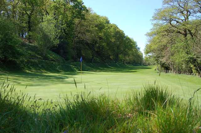 A sunny day view of a hole at Okehampton Golf Club.