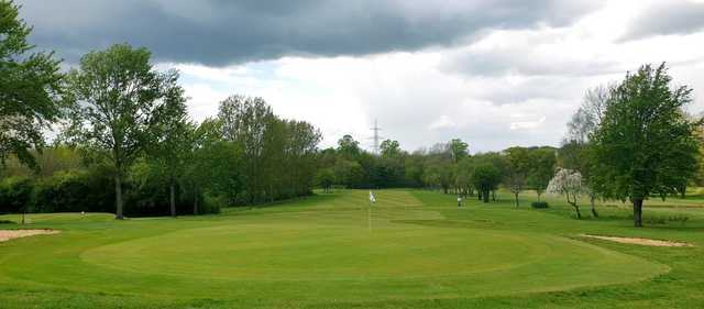 A cloudy day view of a hole at Uxbridge Golf Course from Harefield Place Golf Club.