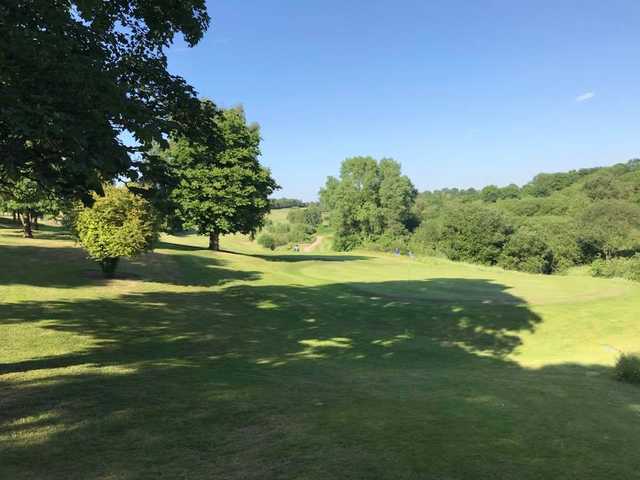 A sunny day view of a hole at Bury Golf Club.