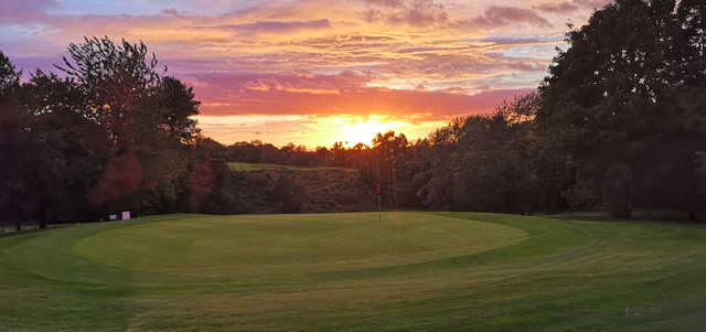 A sunset view of a hole at Stand Golf Club.