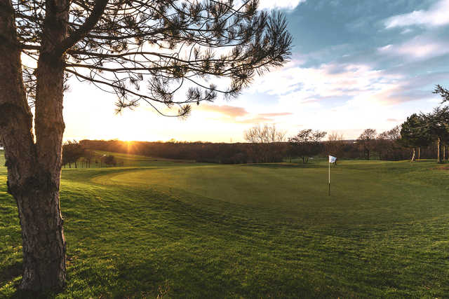 A sunset view of a hole at Skylark Golf & Country Club.