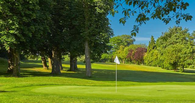 A sunny day view of a hole at Aldenham Golf Club.