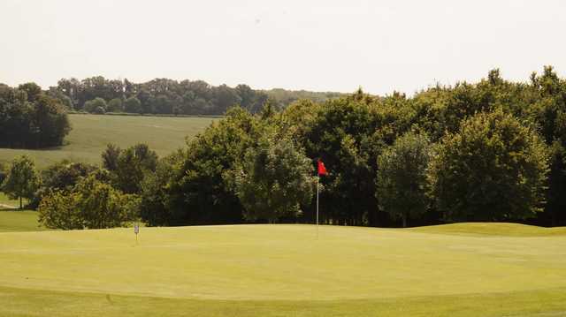 A sunny day view of a hole at Whitehill Golf Club.