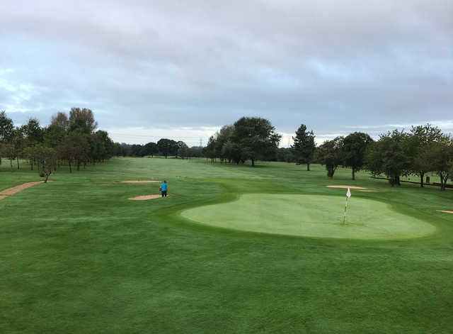 A view of a hole surrounded by bunkers at Ashton & Lea Golf Club.