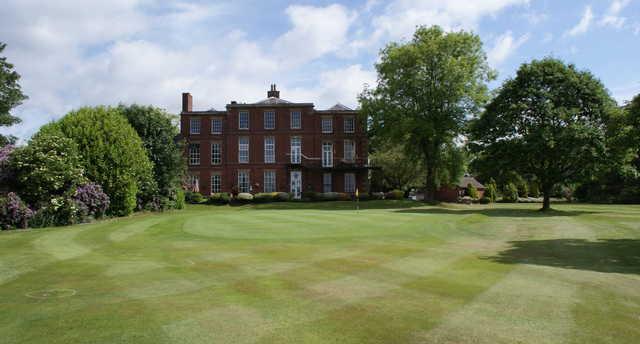 A sunny day view of a green at Hindley Hall Golf Club.