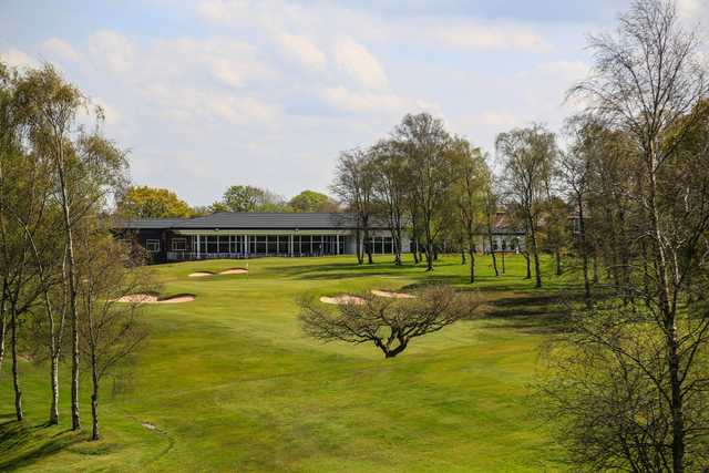 A view of a well protected green and the clubhouse at Penwortham Golf Club.