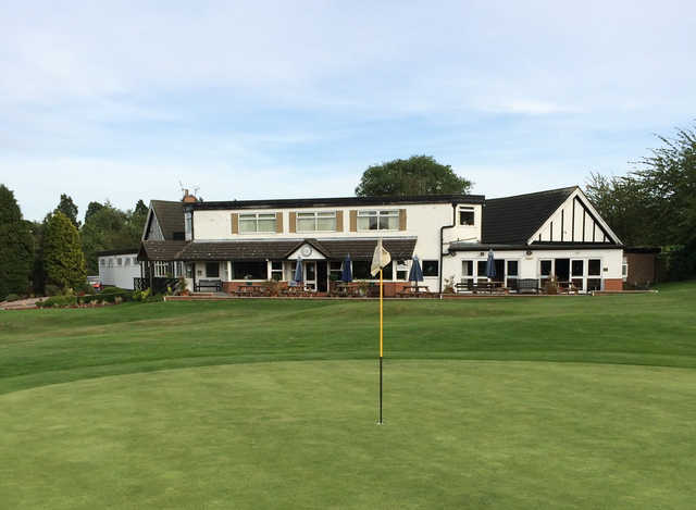 A view of a hole and the clubhouse at Kirby Muxloe Golf Club.