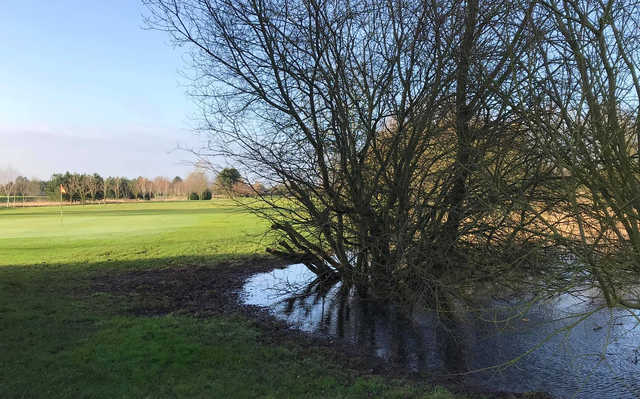 A view of a green with water coming into play at South Kyme Golf Club.