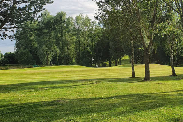 A sunny day view of a hole at Drax Golf Club.