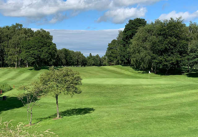 A sunny day view of a hole at Knaresborough Golf Club.