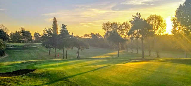 A sunset view of a hole at Kingsthorpe Golf Club.