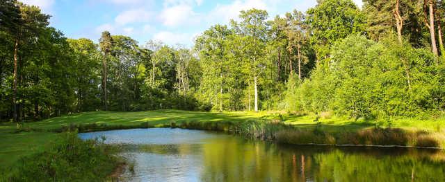 A view over the water of a hole at Macdonald Linden Hall Golf & Country Club.