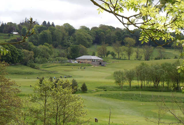 A view of a tee and the clubhouse in the distance at Rothbury Golf Club.