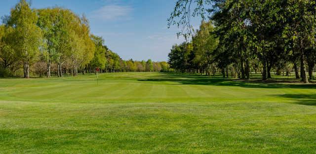 A spring day view of a green at Newark Golf Club.