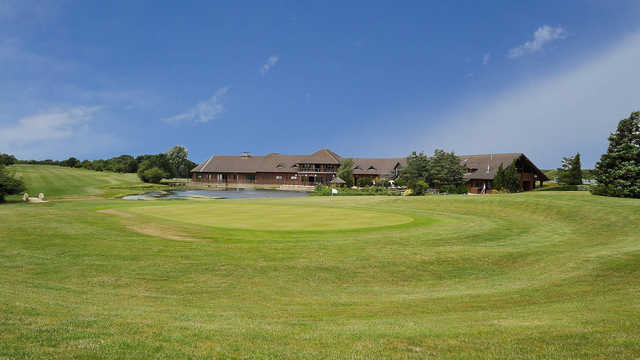 A view of a green and the clubhouse at Witney Lakes Resort.