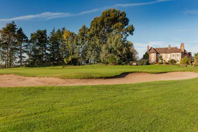 A sunny day view of a green at Telford Hotel & Golf Resort.