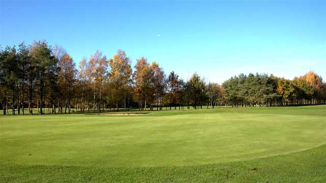 A fall day view of a green at Newton Green Golf Club.