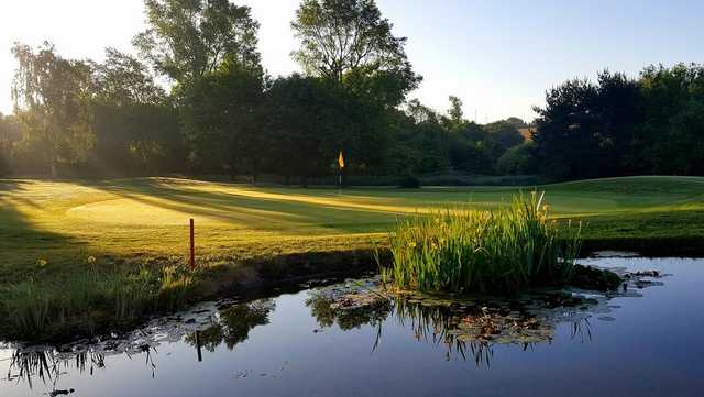 A view of the 17th green with water coming into play at Seckford Golf Club.