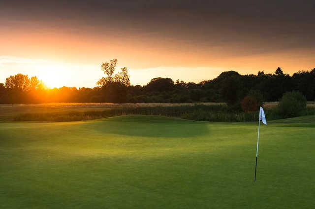 A sunset view of a hole at Surrey Downs Golf Club.